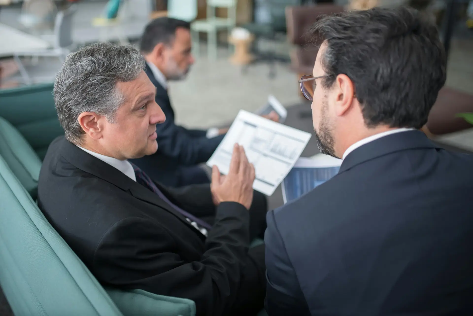 IT team members listening to a client explain a technical issue