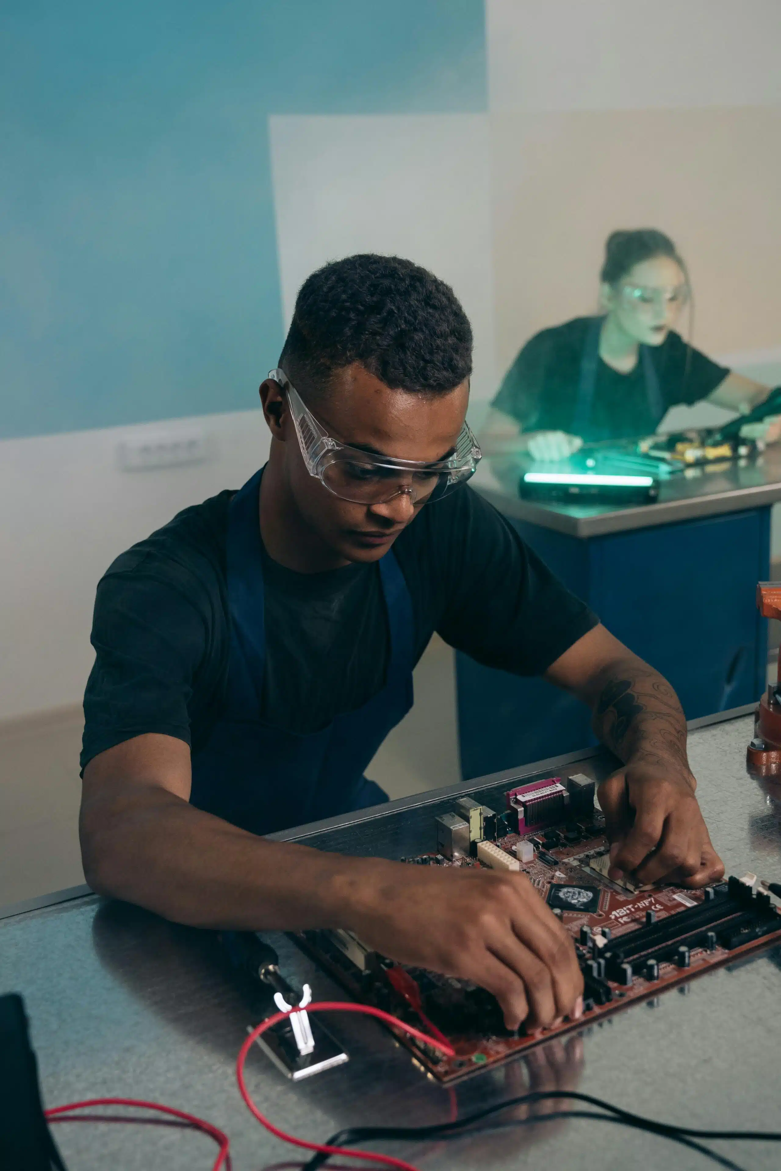 Engineer working on a motherboard